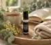 Diluted aromatherapy roller and botanical balm beside lavender and a simple safety checklist
