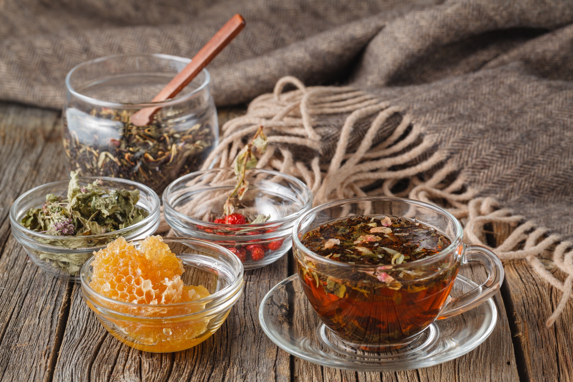 Folk alternative medicine concept. Herbal honey tea woth berryes