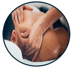 A person receiving a back massage in a serene setting, highlighting relaxation and wellness. The image emphasizes therapeutic techniques in massage therapy.